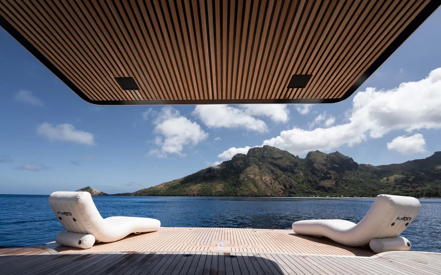 Sun loungers on the aft deck of M/Y Impulsive, Fiji at dusk
